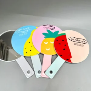 Producto de belleza - Espejo Summer Watermelon con imágenes de frutas en la parte trasera.